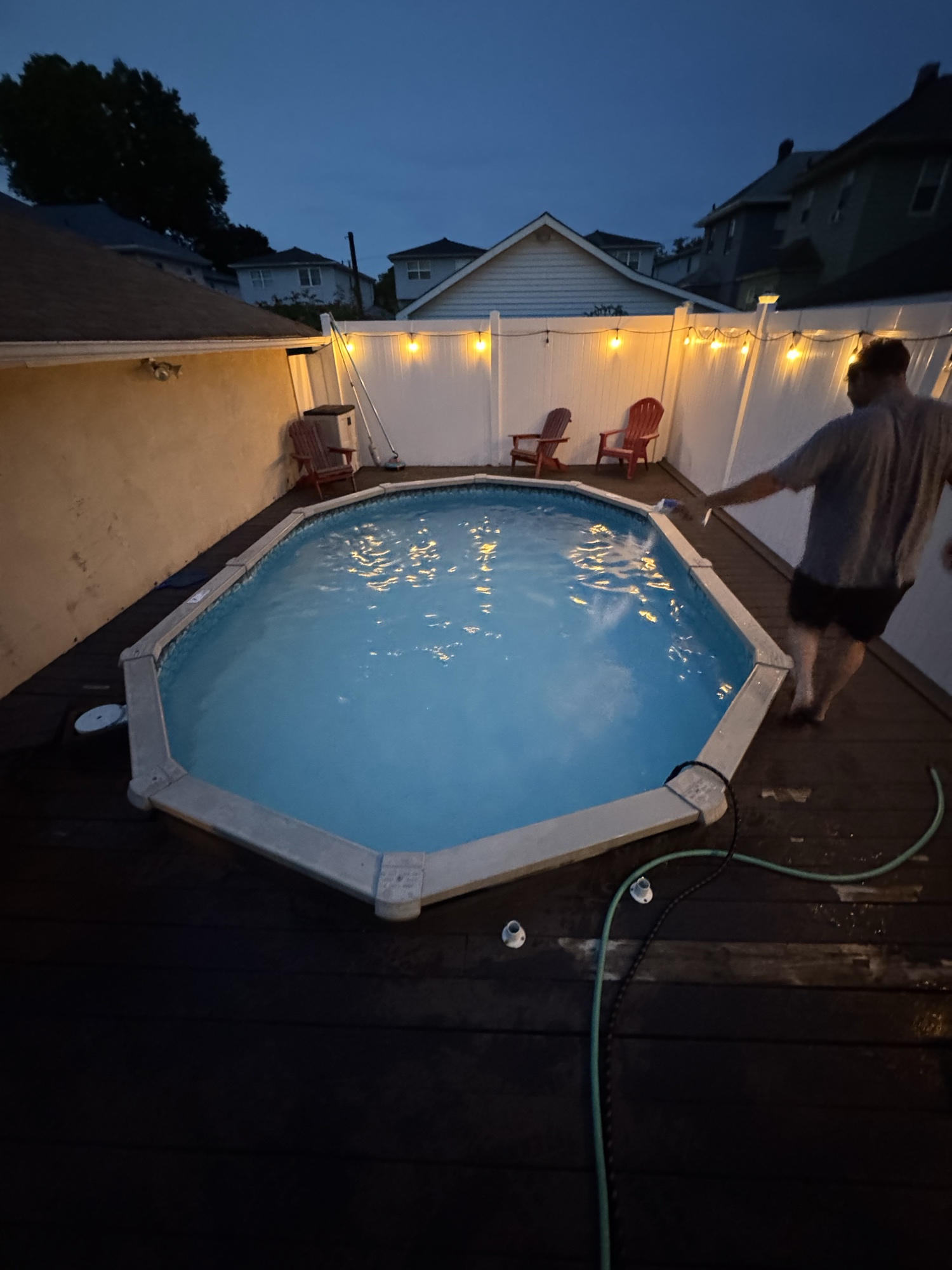 Octagonal above-ground pool evening